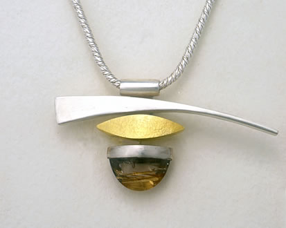 Munich muse necklace in silver and gold with Bar and tongue cut Rutilated Quartz stone